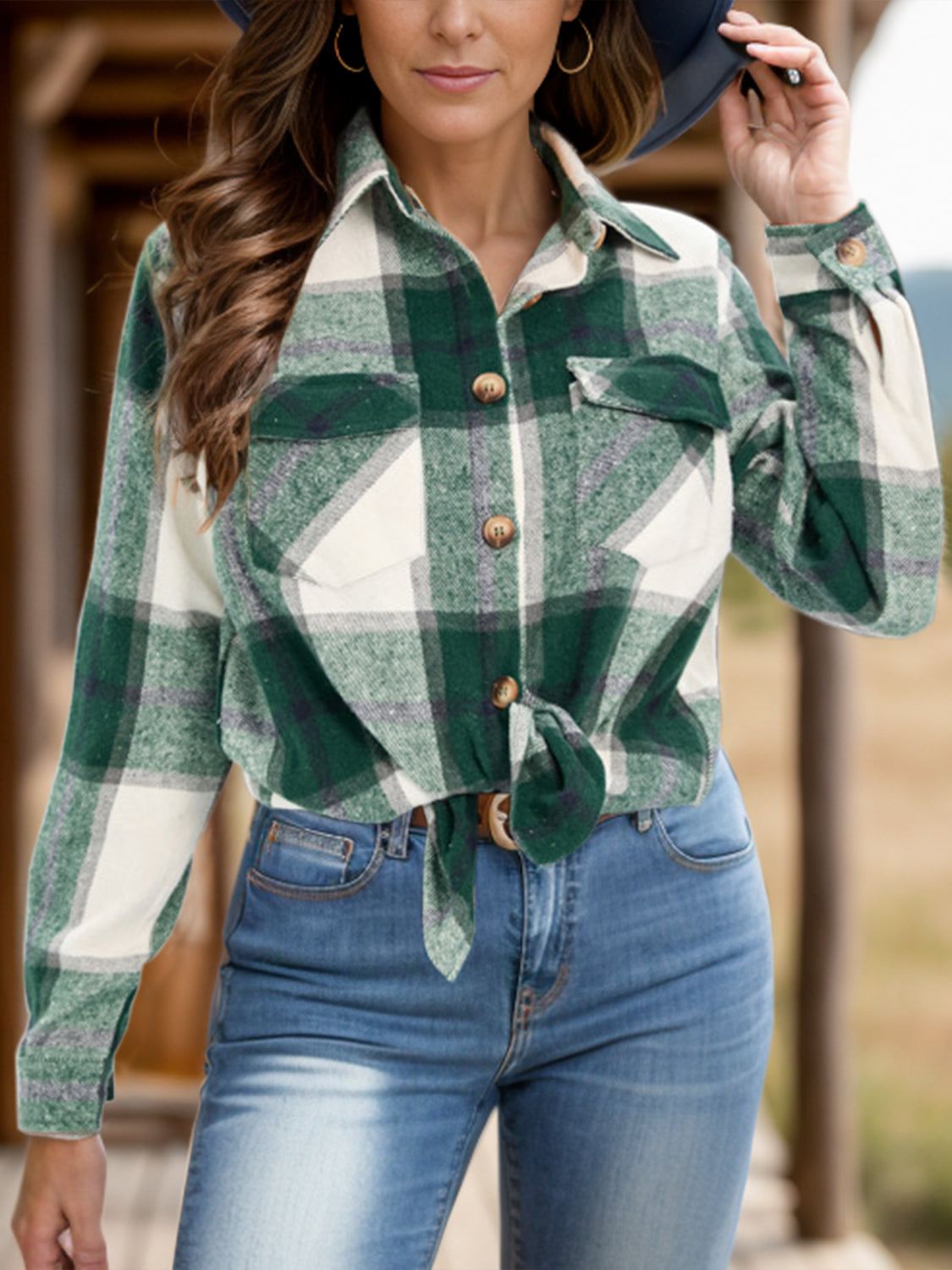 Green plaid button-up shirt paired with a casual outfit.
