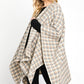 Ivory plaid shawl in a classic pattern, perfect for cozy fall days.
