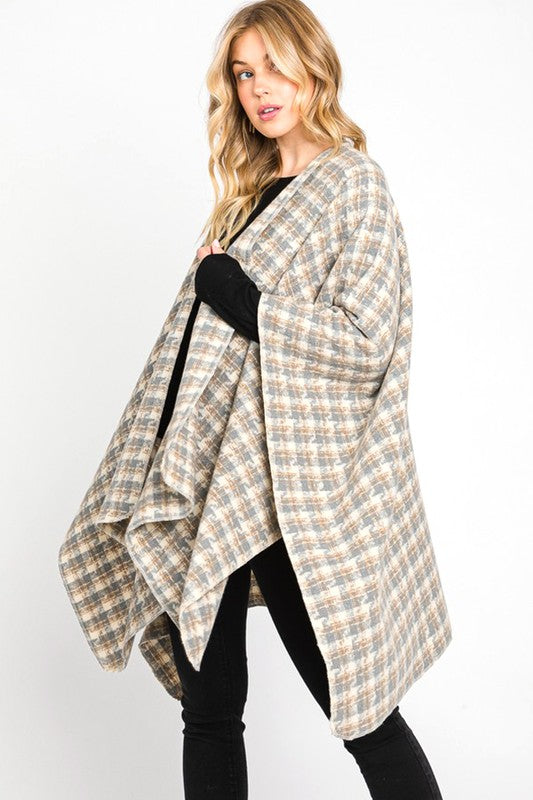 Ivory plaid shawl in a classic pattern, perfect for cozy fall days.
