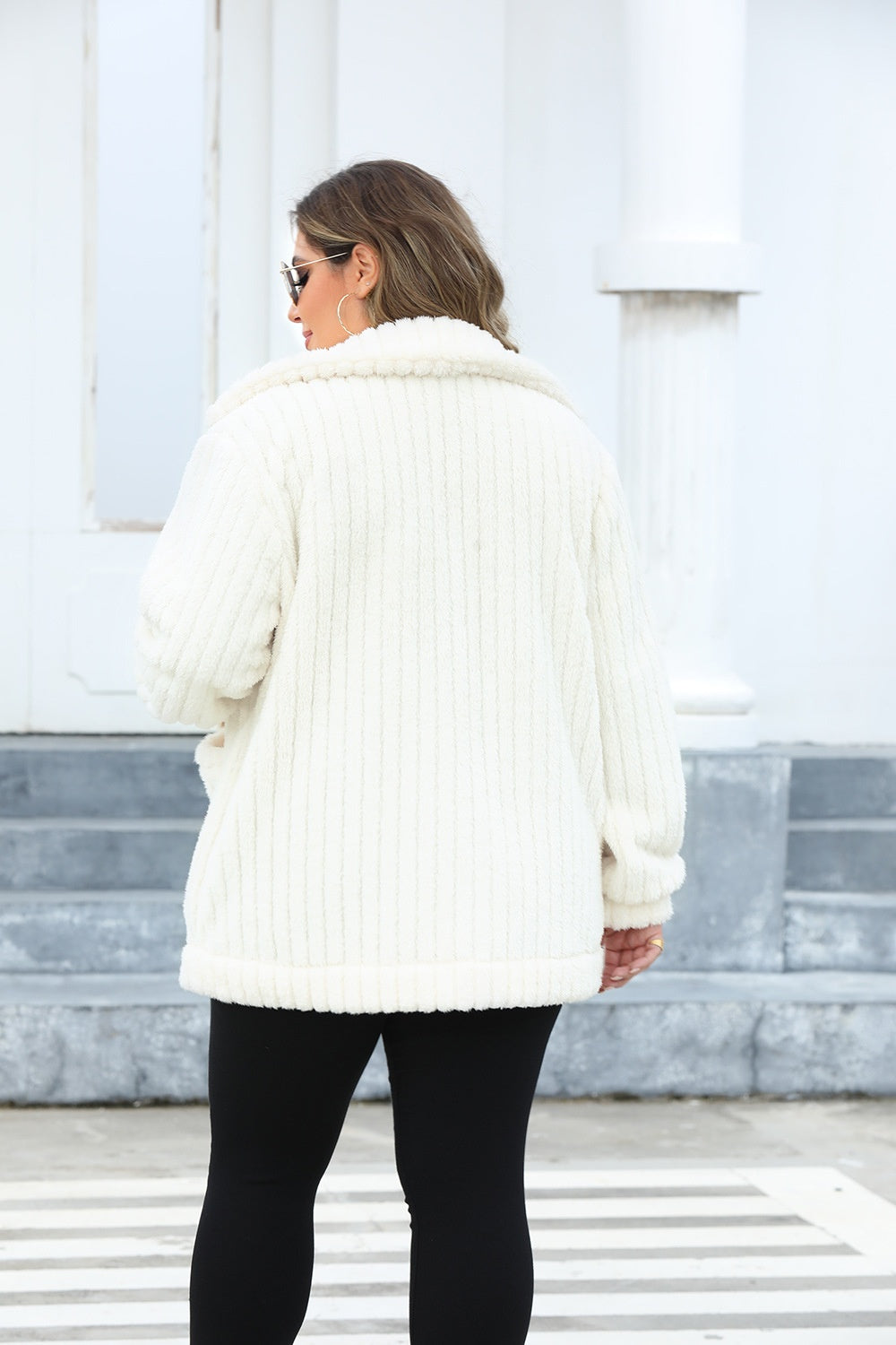 Back view of a women's plus size sherpa jacket in white.
