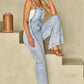 Women’s square neck denim overalls styled for a laid-back look.
