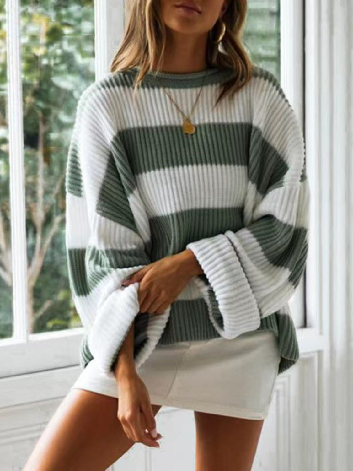 Cozy sage green wide-striped pullover for a comfortable, laid-back look.
