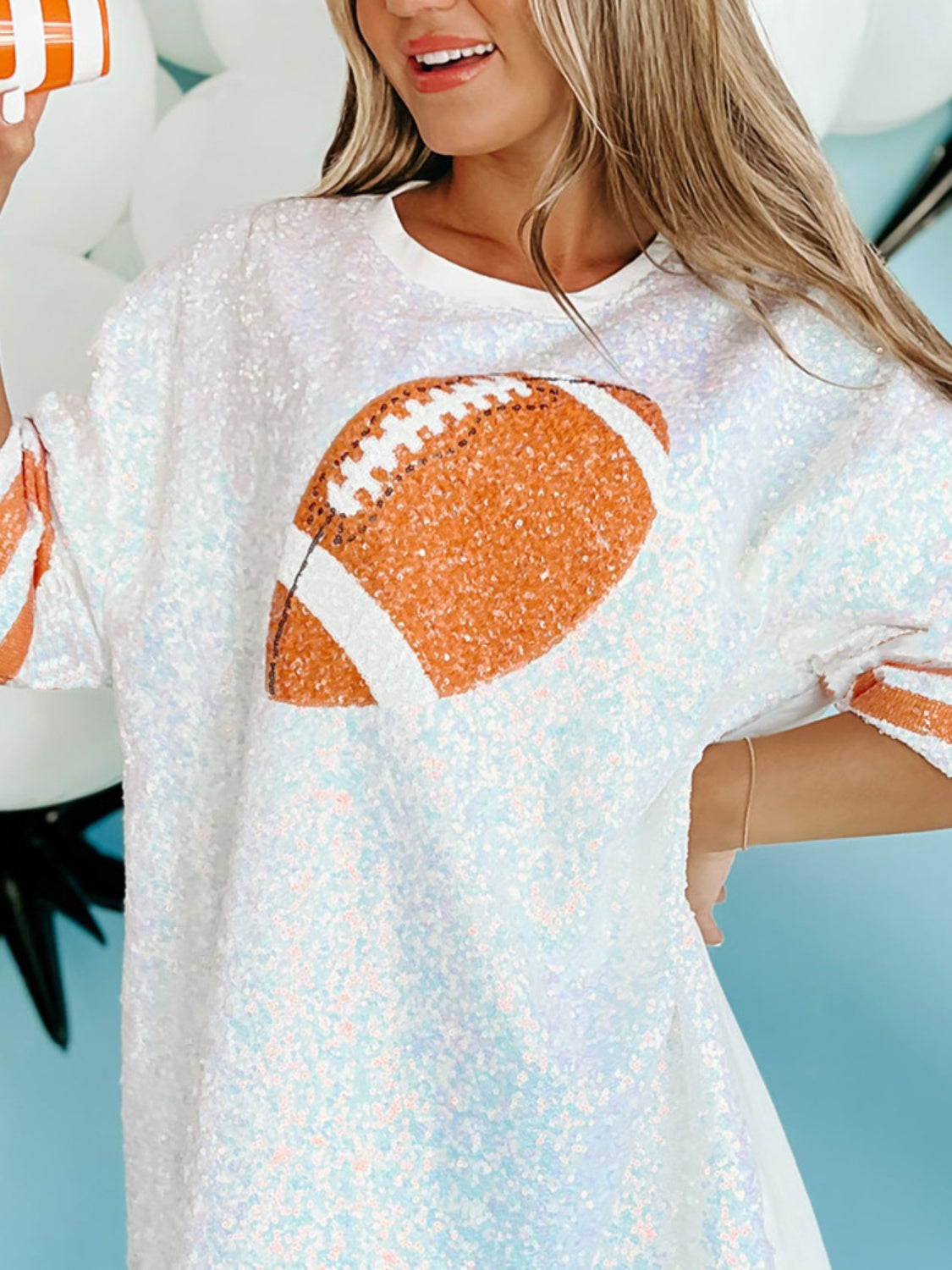 Oversized game day top with white sequins and a bold football graphic