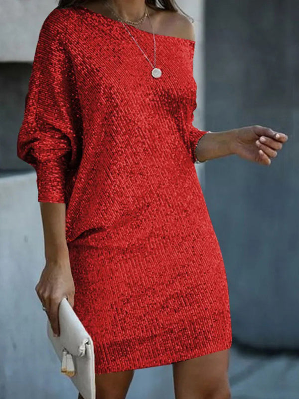 Off-shoulder red sequin dress styled with minimal jewelry.
