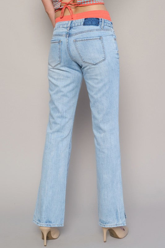 Women's straight-leg jeans featuring a subtle slit at the hem.