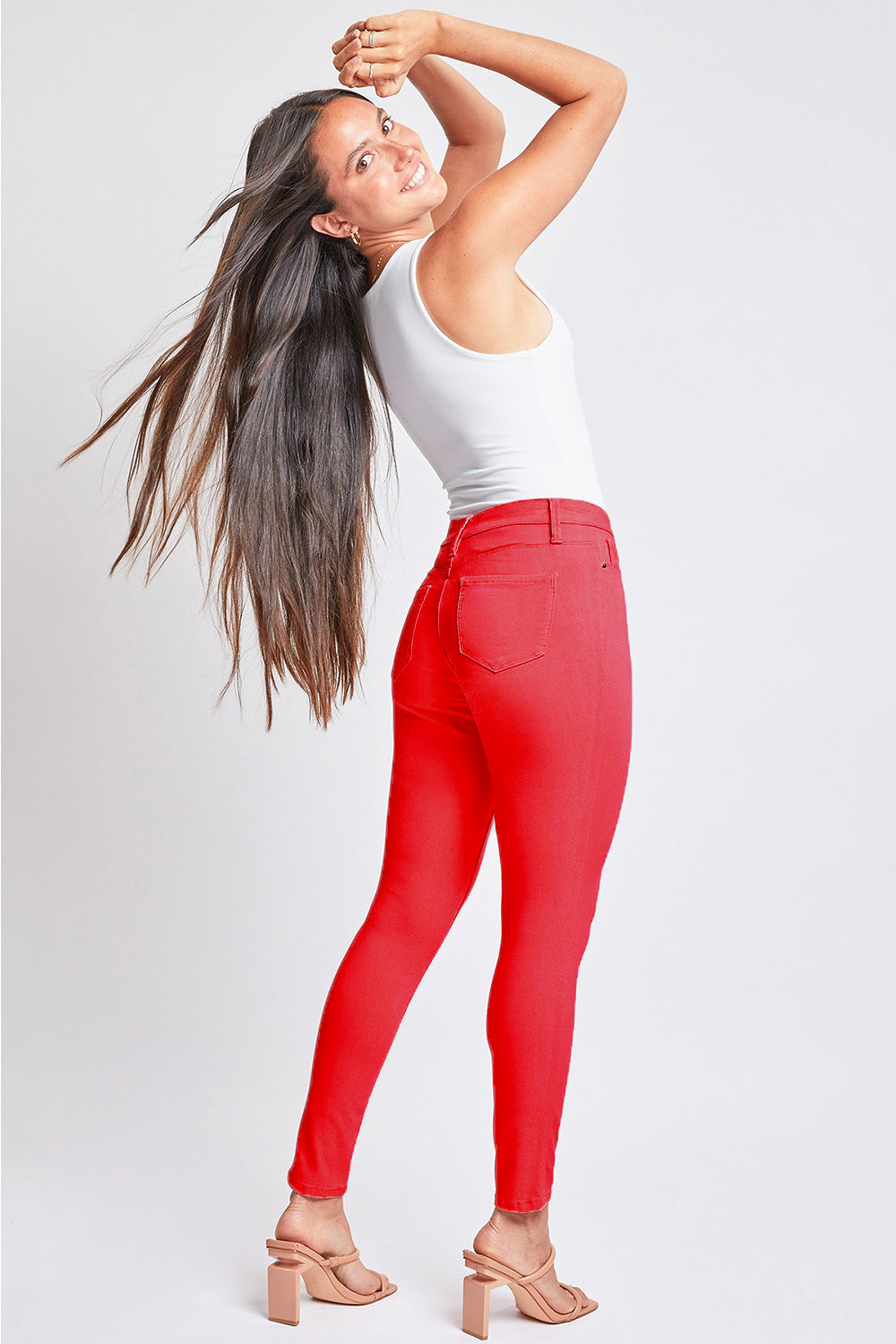 Bold red denim jeans with a flattering skinny fit and mid-rise waist.
