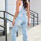 Cotton-polyester denim overalls with adjustable straps and stylish distressing.
