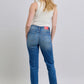 Women’s denim pants with plaid print cuffs, ideal for casual looks.