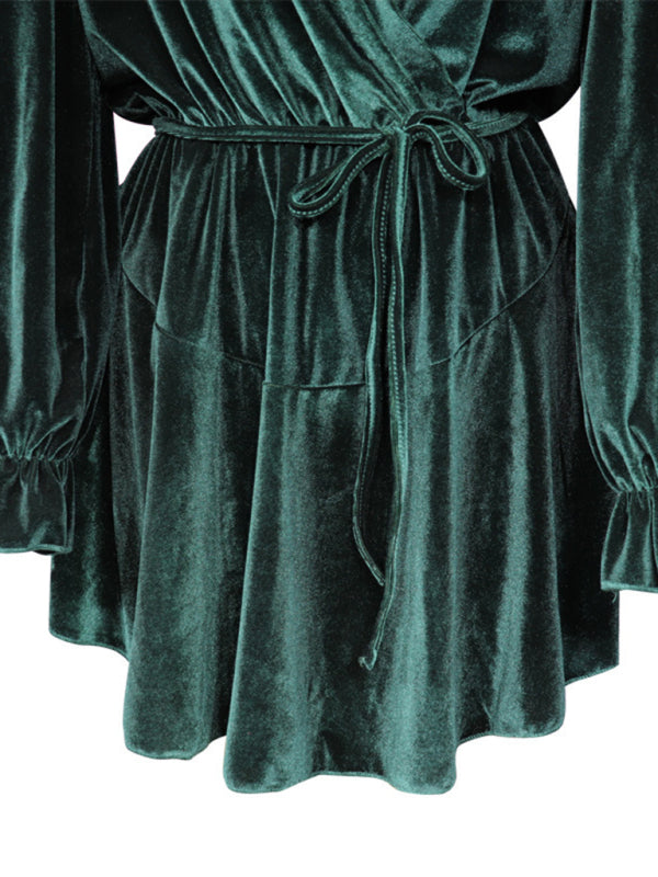 Green velvet party dress with long sleeves and adjustable waist tie.
