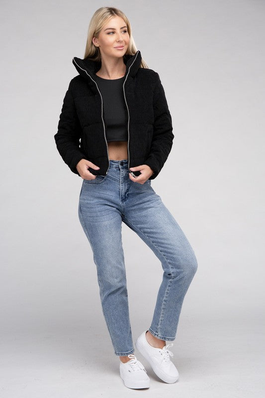 Women’s black corduroy zip-up jacket with long sleeves and a cozy high collar, perfect for cooler weather.
