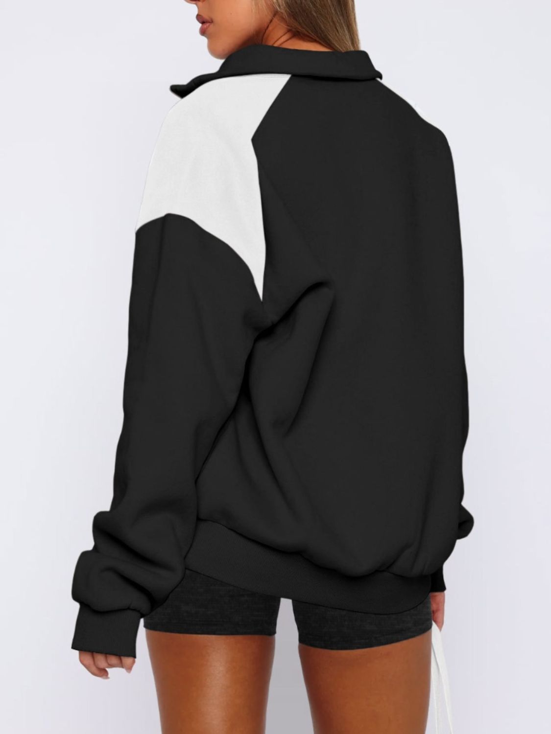 Casual black half-zip color block sweatshirt for women.
