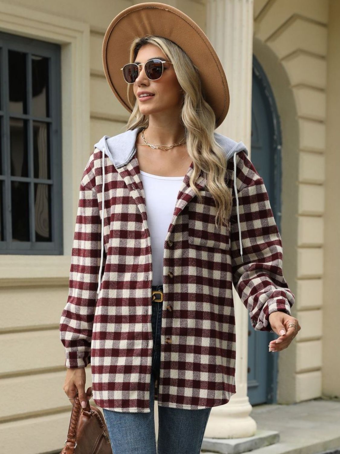 Women's brown plaid jacket with a functional hood, ideal for outdoor adventures
