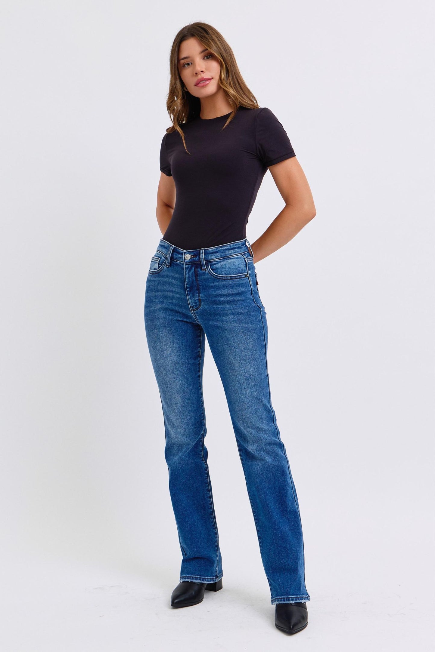 Dark wash bootcut jeans with moderate stretch for flexibility
