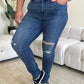 Women's high-rise skinny jeans by Judy Blue with edgy distressed details.
