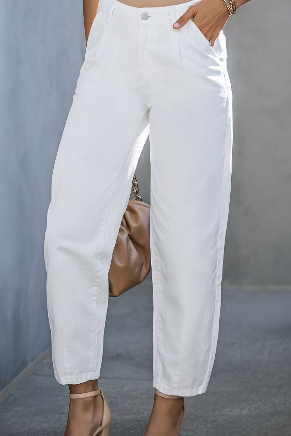 Women’s white high-waist jeans with a clean, crisp look.
