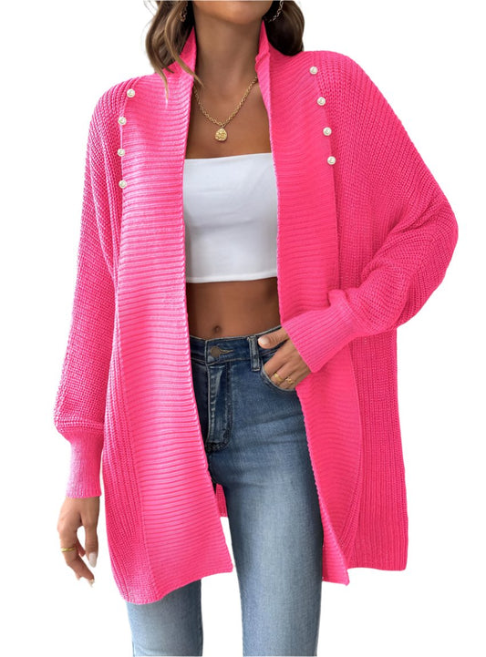 Woman wearing a pink women's open front cardigan with pearl buttons
