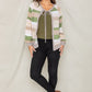 Olive cardigan featuring a tie-front design and colorful striped pattern.