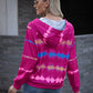 Close-up of a woman in a pink tie-dye hoodie with a relaxed fit and white drawstrings, styled for a casual day out.
