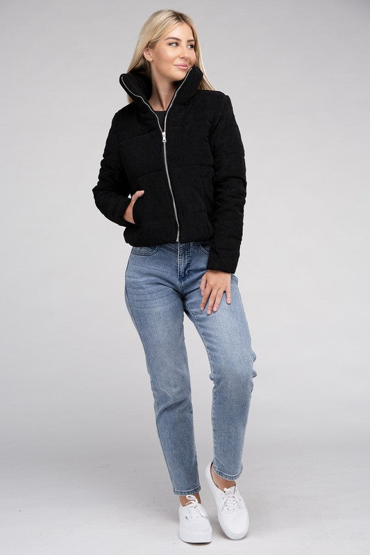 Women’s cozy black corduroy jacket with a zip-up closure, perfect for staying warm and stylish in the fall.