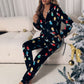 Black fleece hooded jumpsuit with holiday light string design
